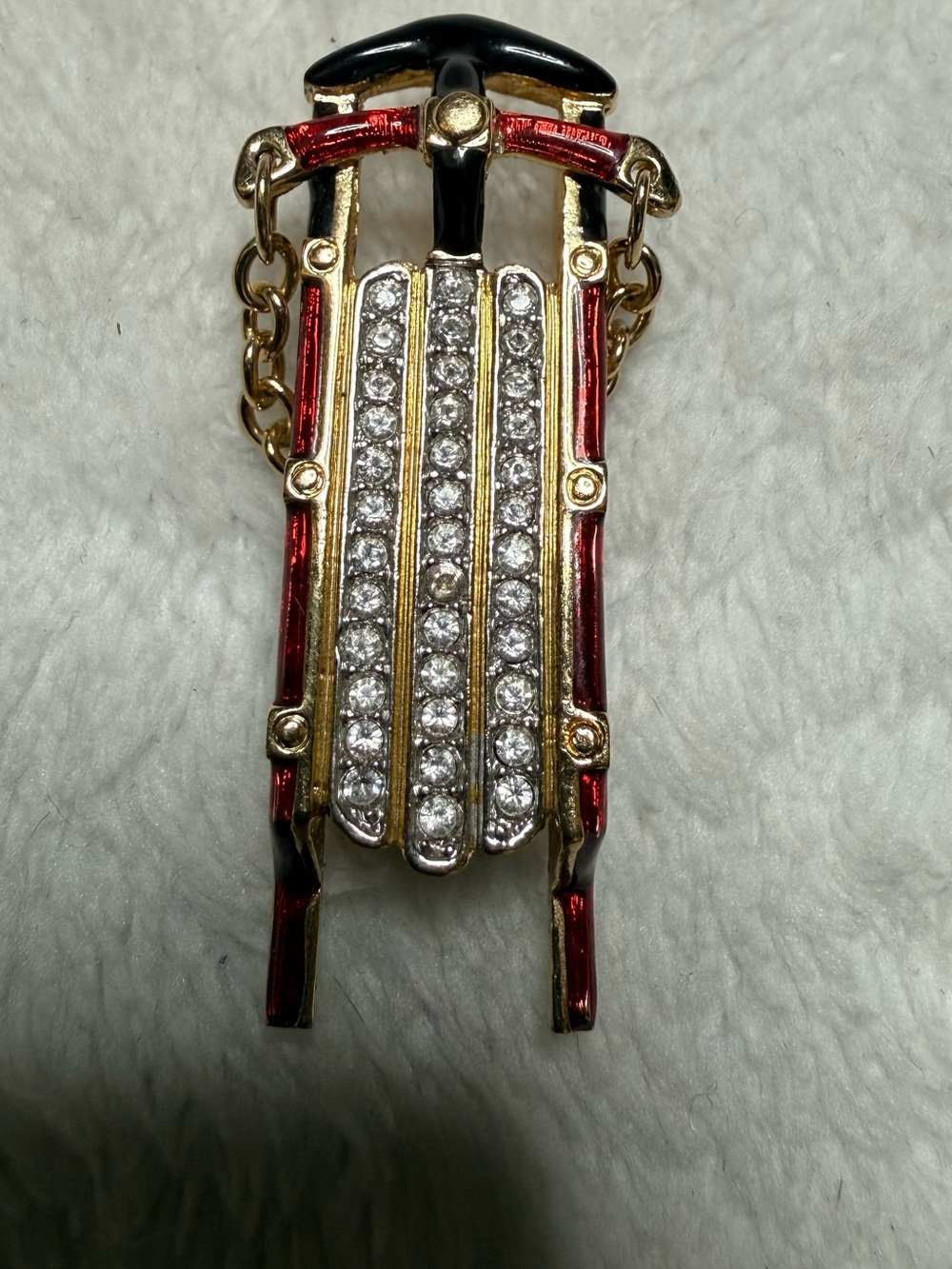 Swarovski Gold Tone Sled Brooch with Red Enamel and Clear Crystals